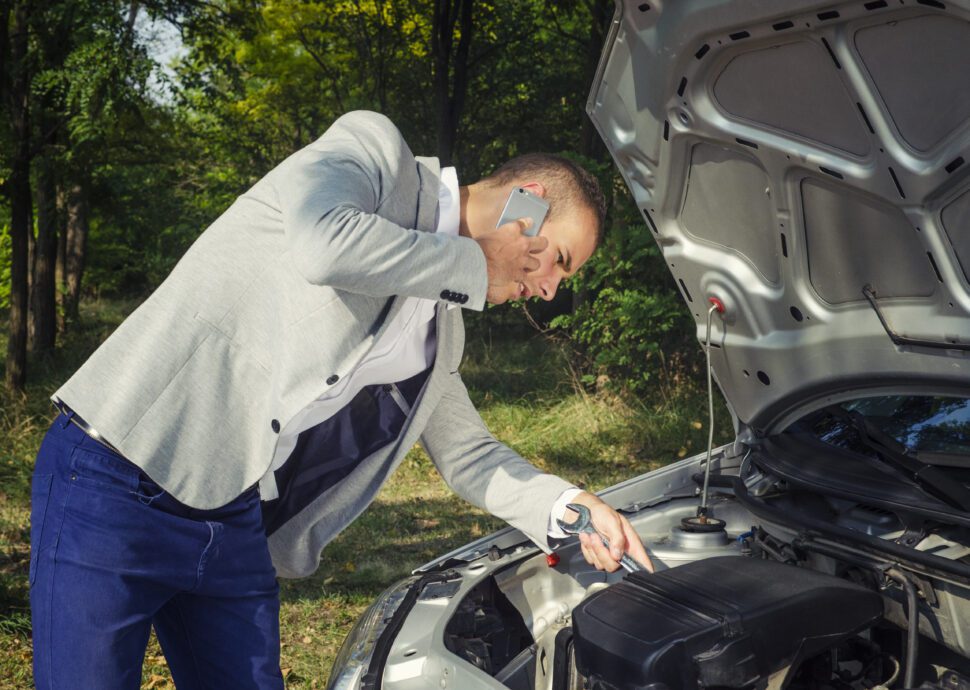 Man trying to fix vehicle